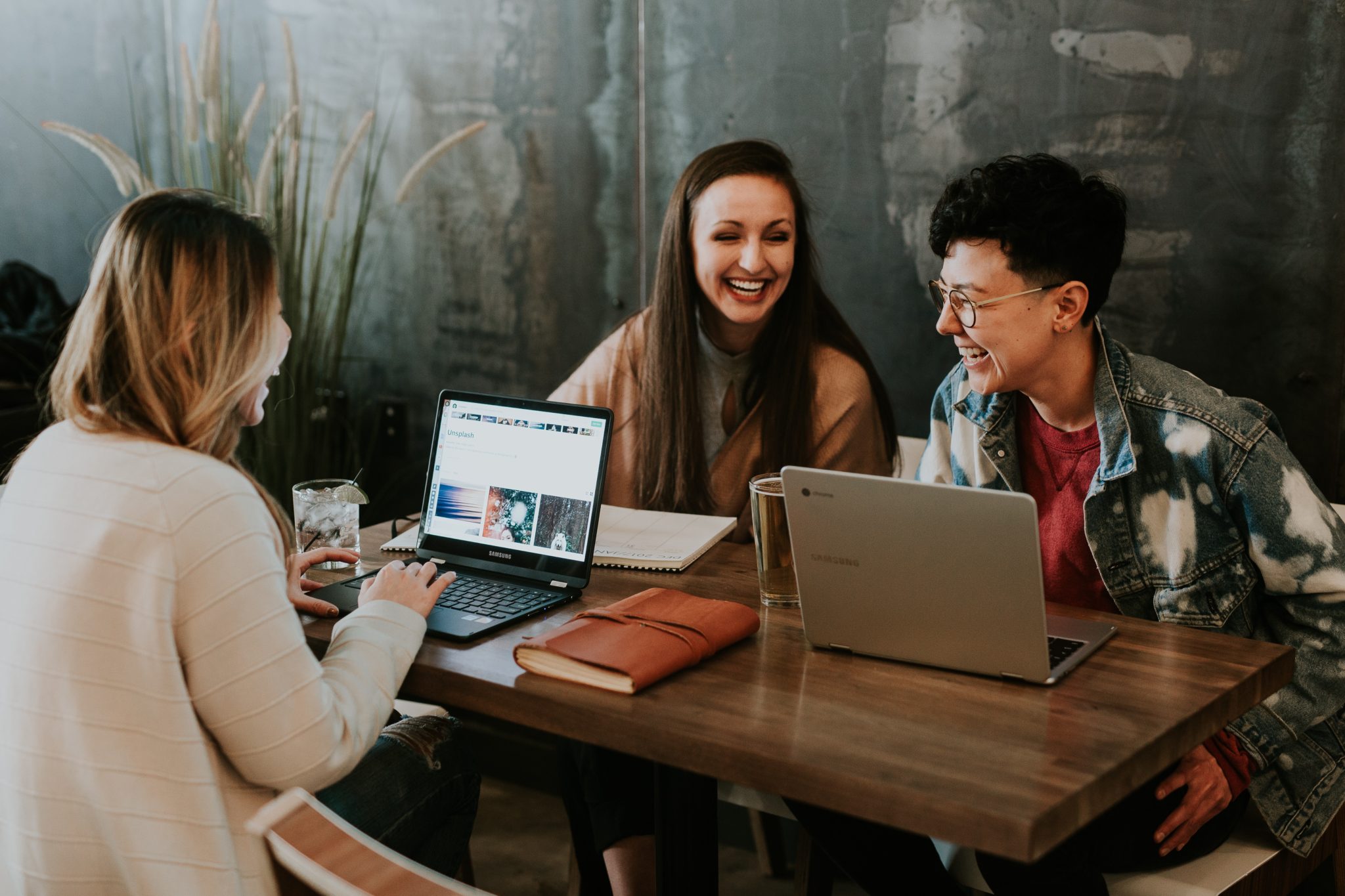 group sitting with computers